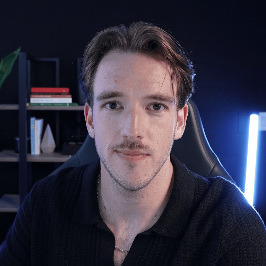 Aaron Shepherd seated in a dark office