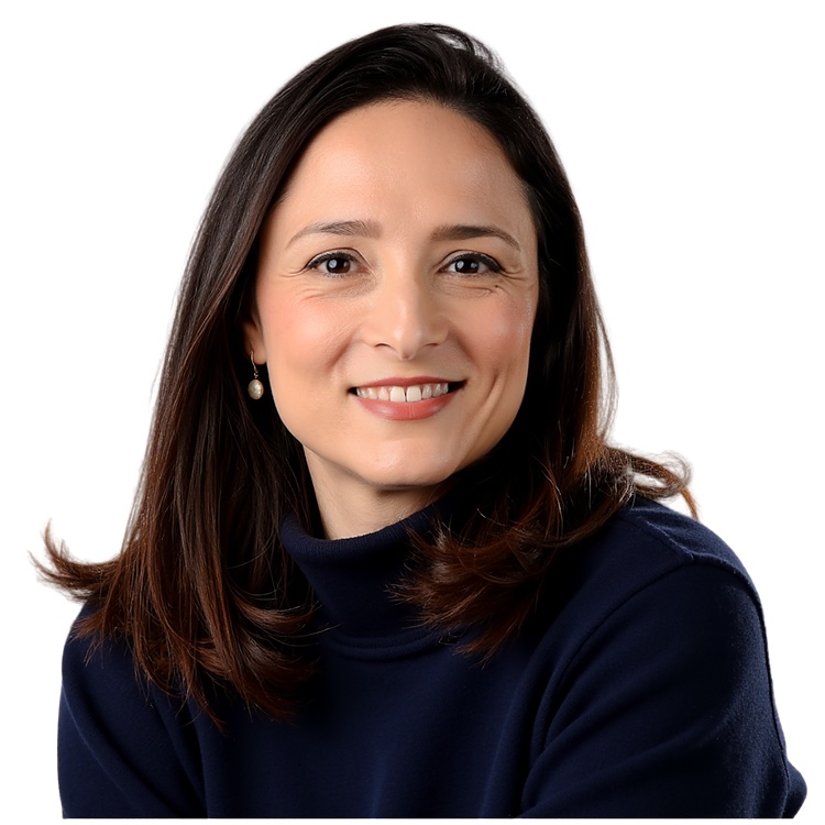Nesrine Changuel smiling in a navy top against a light background